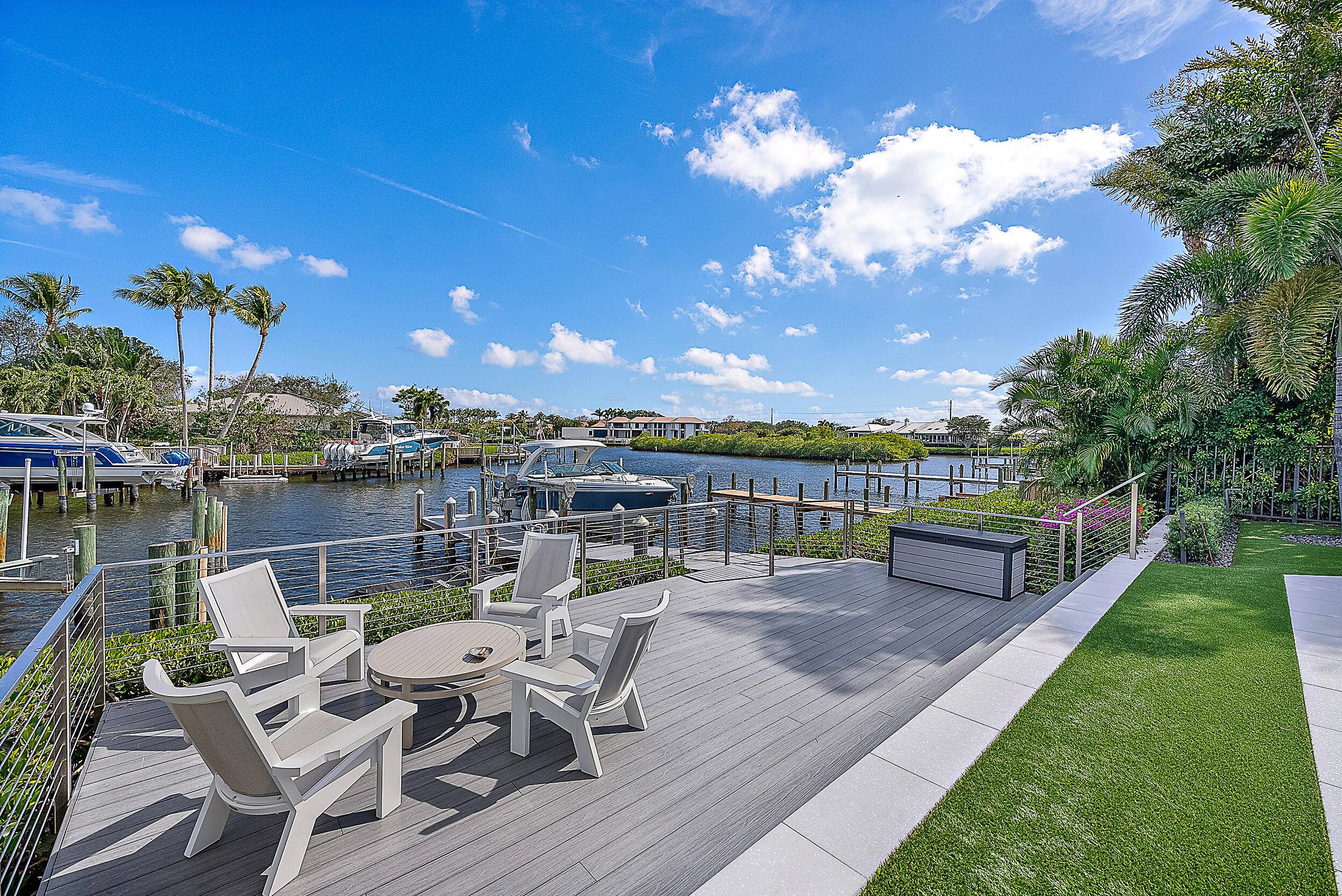 This stunning property, nestled in the prestigious Admirals Cove community, epitomizes modern luxury with its clean lines and sophisticated flair.