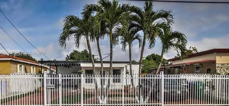 Tastefully and extensively remodeled home with a gated entry and a circular driveway that makes a memorable first impression.