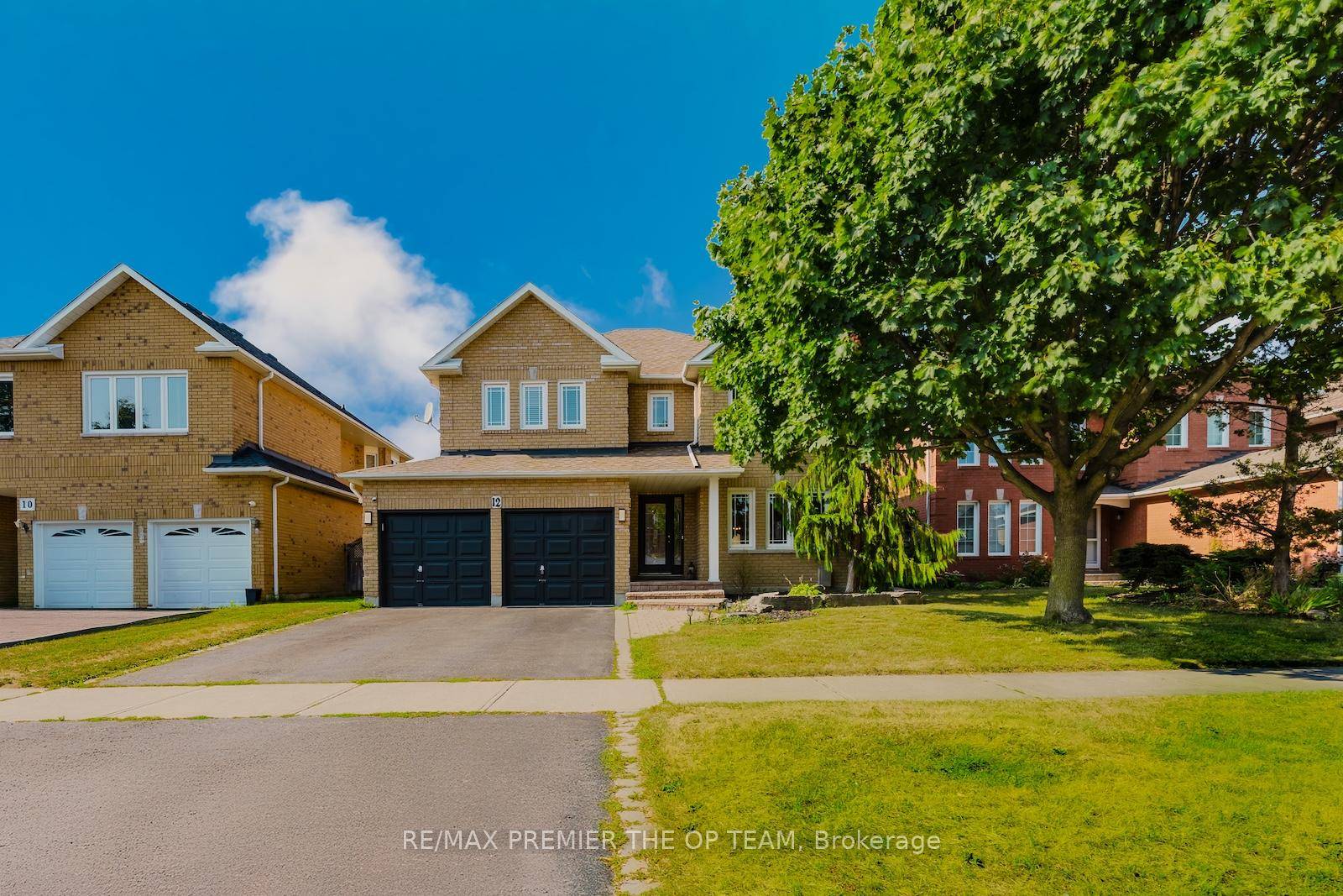 12 Donald Wilson St, a beautifully maintained 4 1 bedroom brick home in the highly sought after Rolling Acres community.