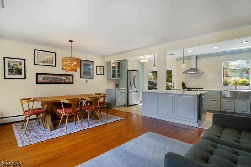 Cedar Lake living with seasonal lake views, set on a quiet corner lot.