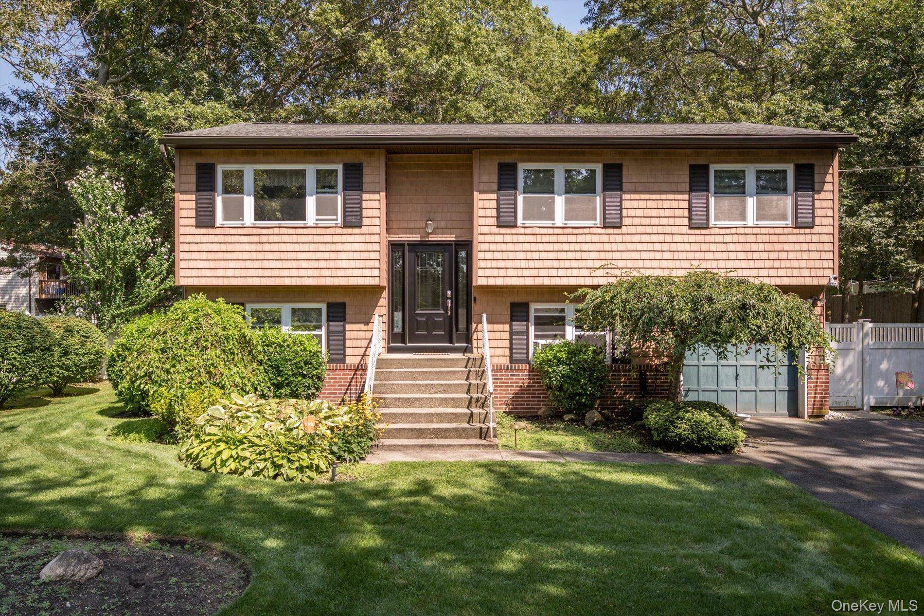 Spacious and versatile Hi Ranch located in desirable North Shirley on a beautifully landscaped.