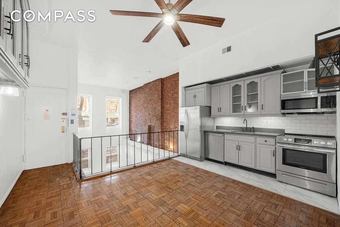 The historic brownstone is a charming duplex with a classic design, located in a historic neighborhood.