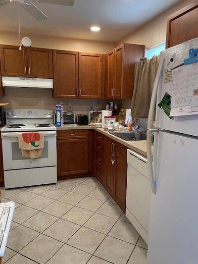 Spacious 1 Bedroom Condo in Oxford at Century Village Most Desirable 55 Building with Resort Style Amenities !