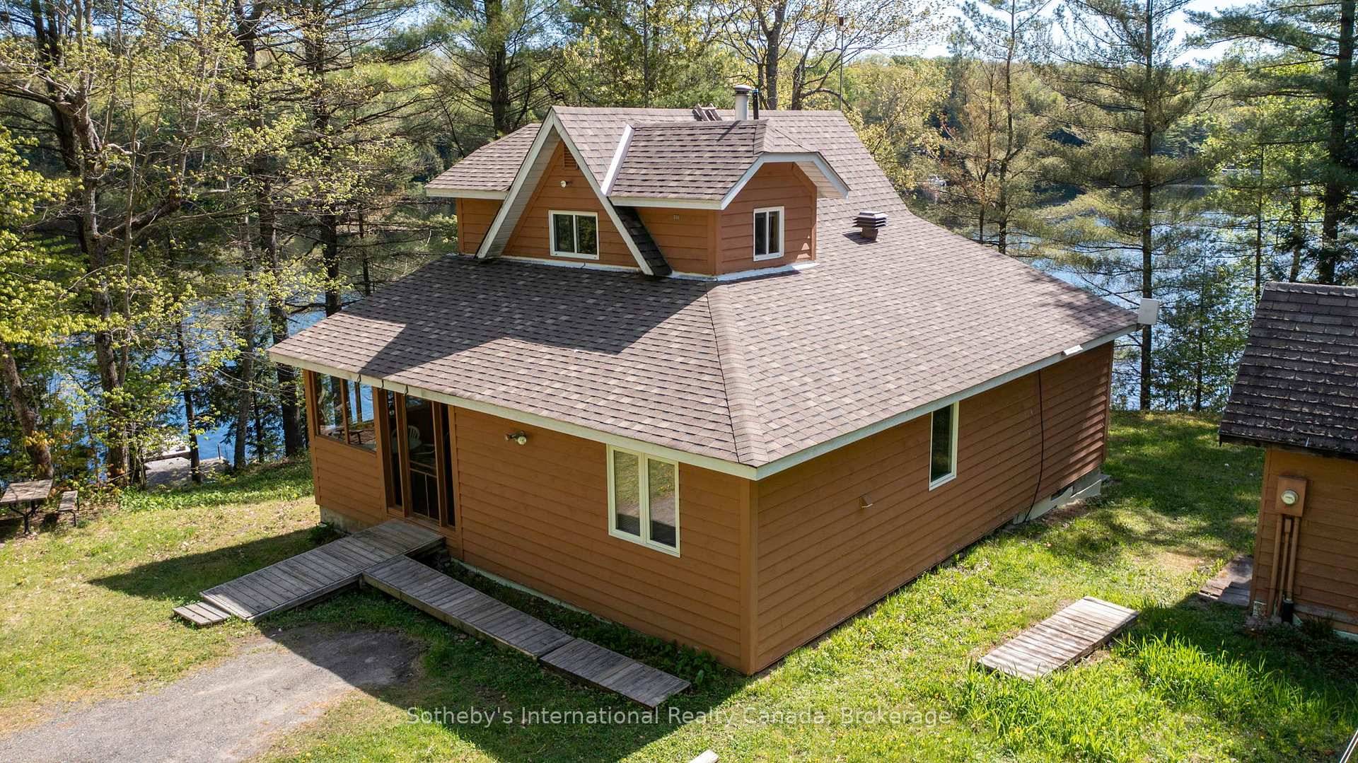 Set on a large lot on Otter Lake is this 3 bedroom, 2 bathroom chalet style cottage with 4 season sunroom overlooking a secluded finger of the lake.