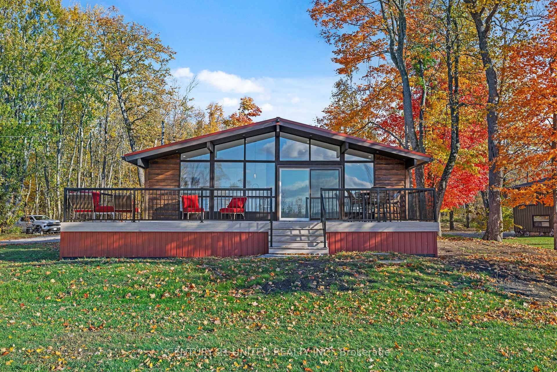Welcome to 17 Rollie's Bay Road East, where modern design meets lakeside charm.
