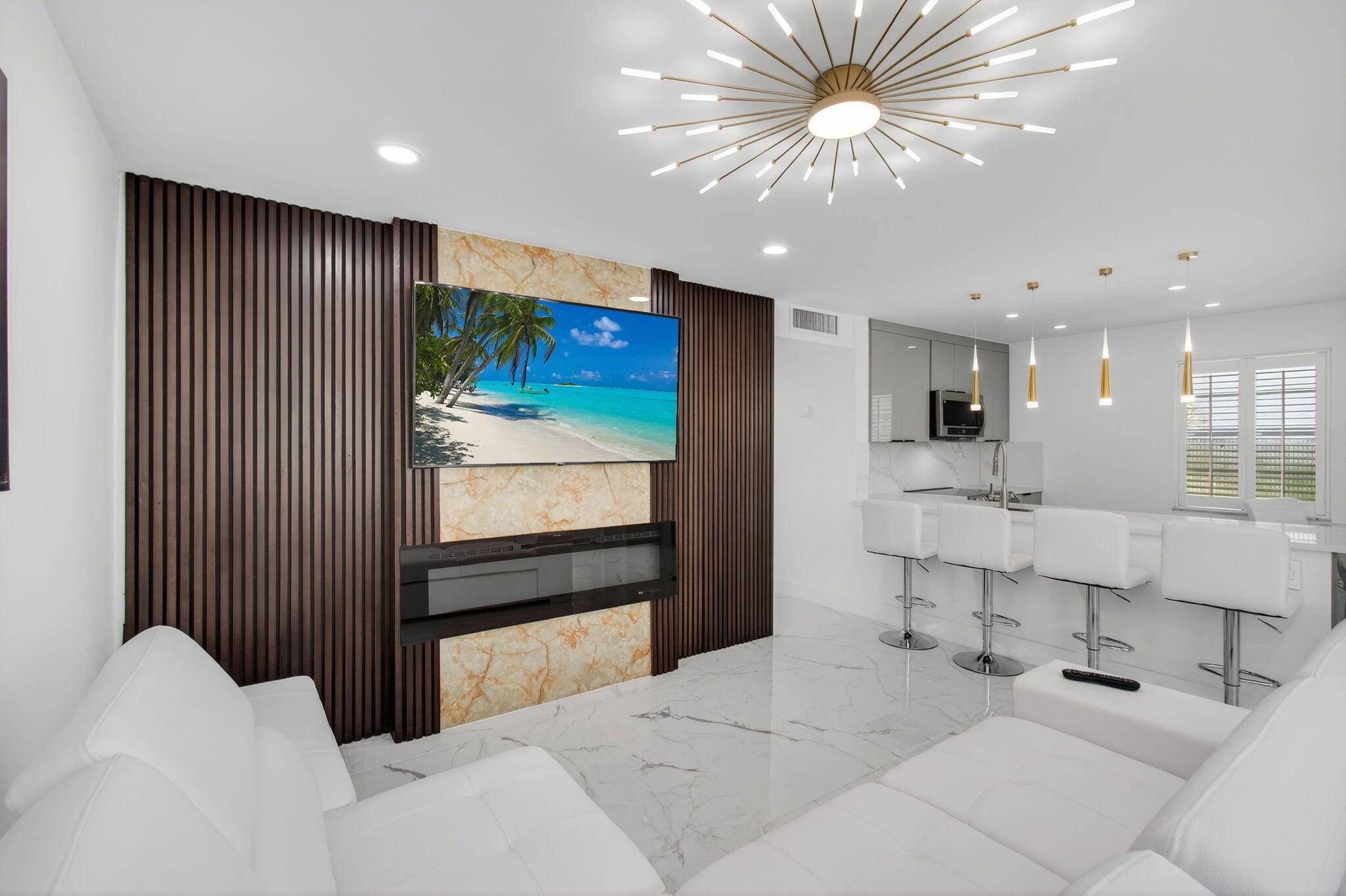 Prepare to be impressed this 1st floor 2 bed, 2 bath Kings Point condo showcases one of the most stunning top to bottom designer renovations in the community, offering pure ...