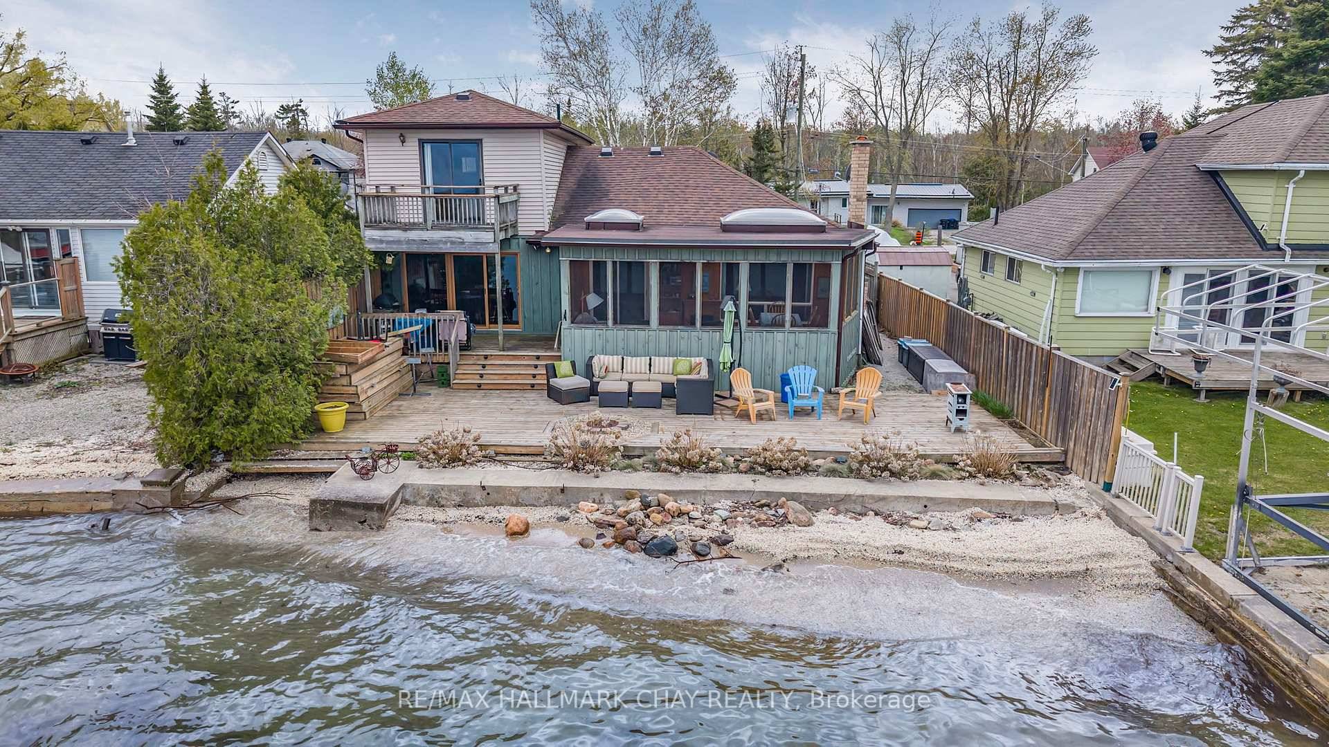 This charming 1 storey home offers the perfect blend of comfort, character, and stunning water views with direct access to your own hard sand beach with crystal clear water.