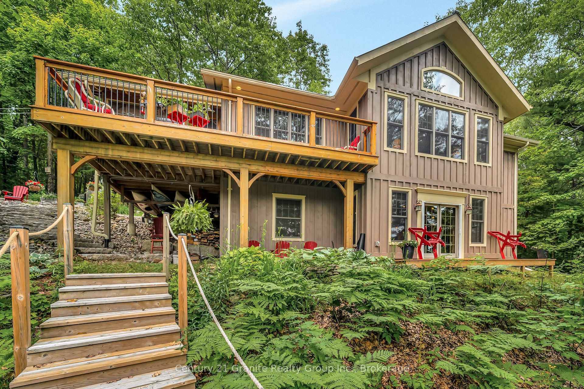 Welcome to your private, custom built retreat nestled in the woods on the shimmering shores of Contau Lake.