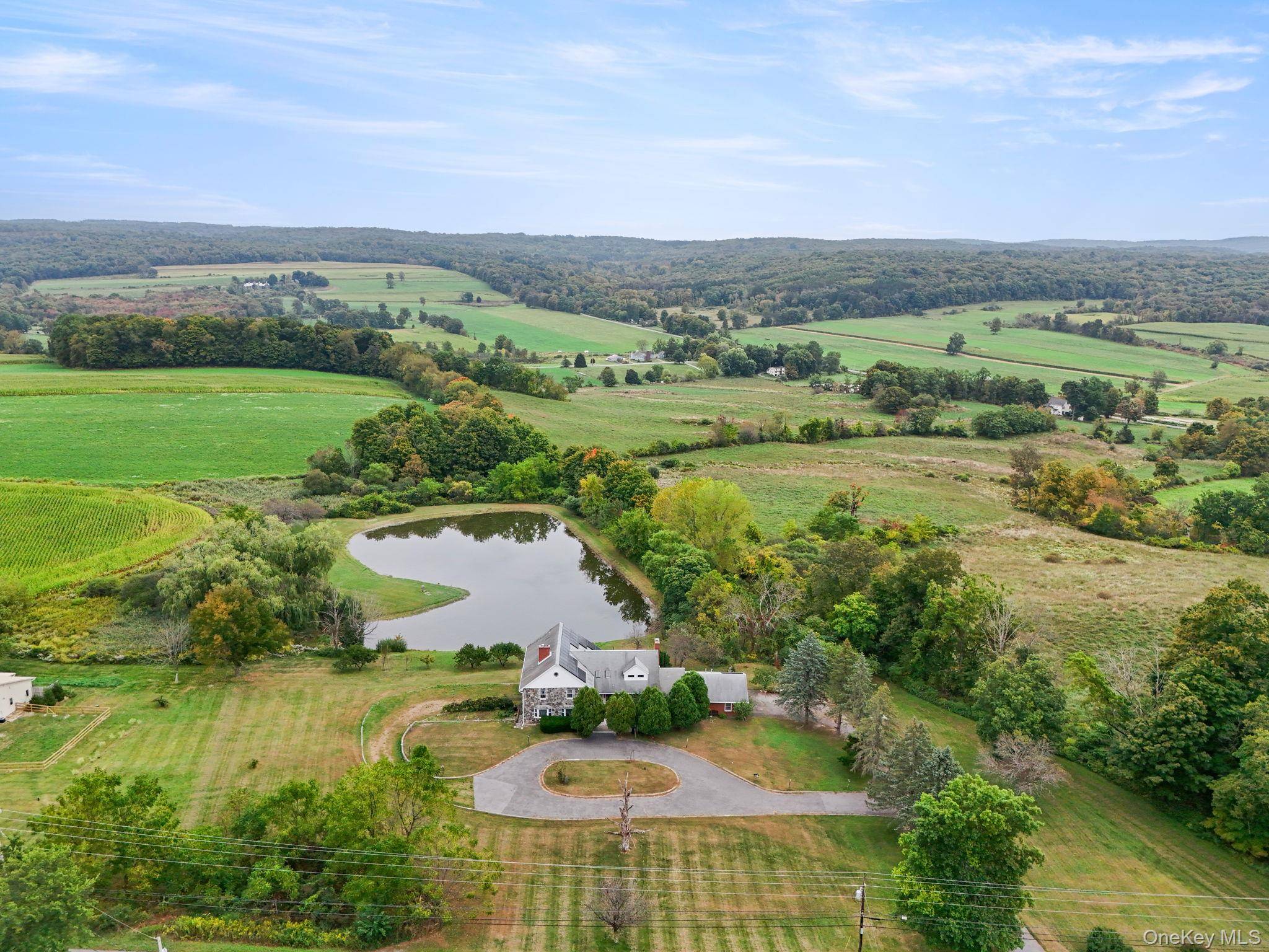 Discover a truly unique Millbrook estate set on over 6 acres with a private pond, fruit trees, and beautiful natural surroundings.