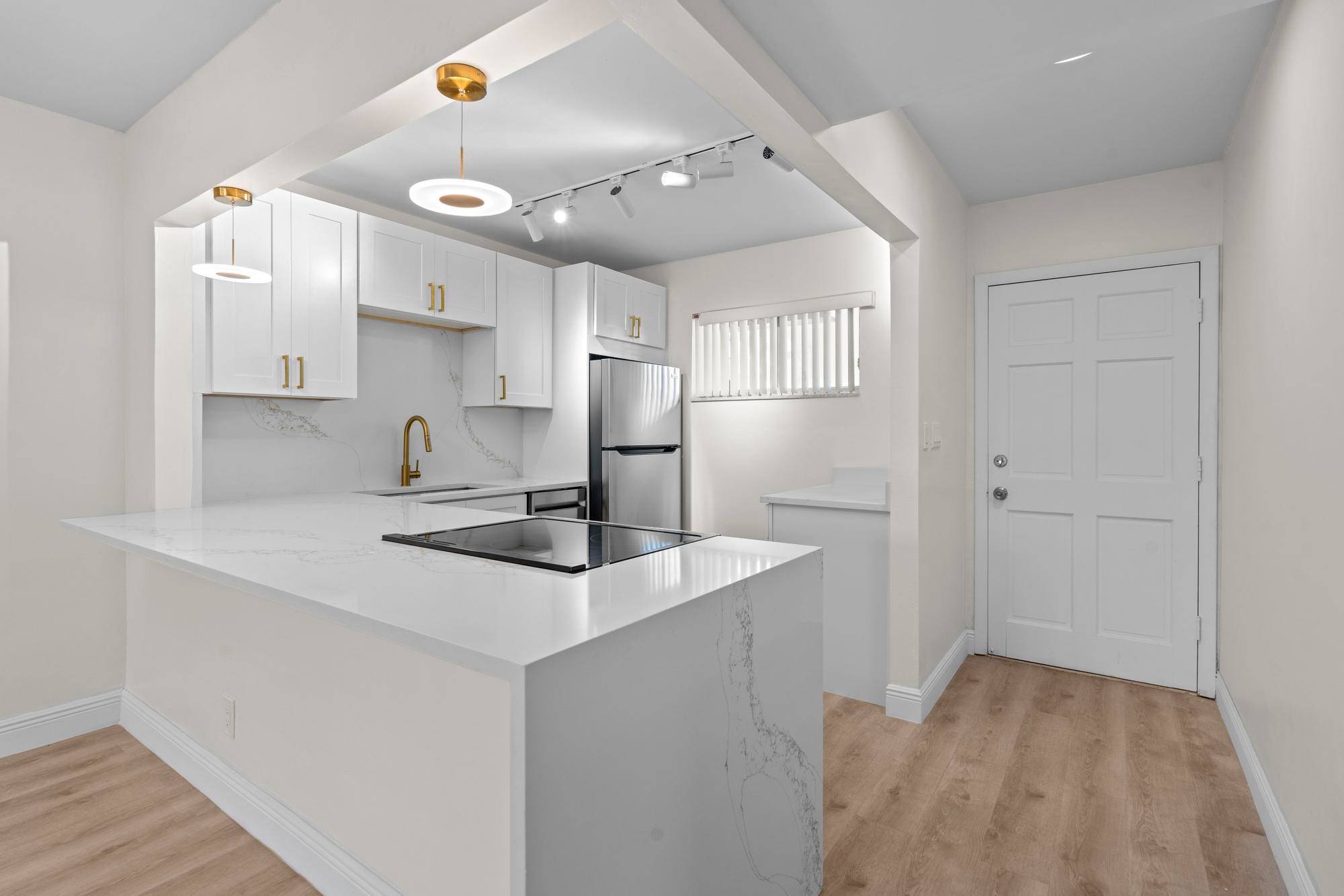 Welcome to this beautifully remodeled 2bed 1bath first floor CORNER unit in beautiful Lake Clarke Gardens.