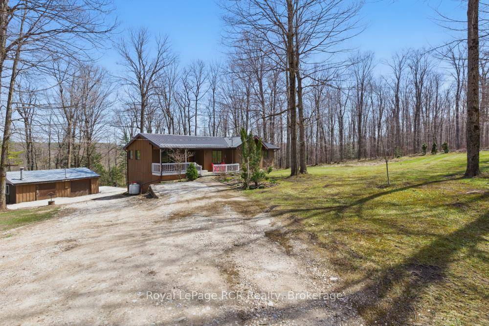 Tucked away on a quiet country road, this 7 acre slice of West Grey offers peace, privacy, and a whole lot of charm.