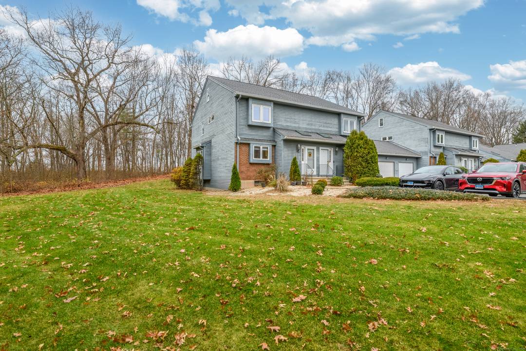 Rare end unit in the most private, fully set back location in Plum Ridge !