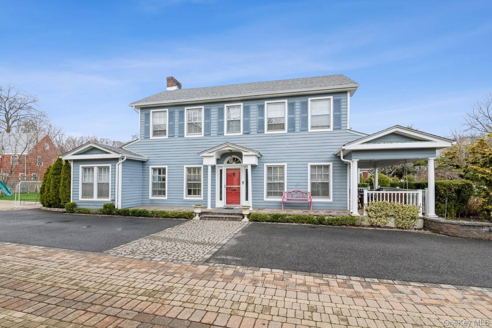Welcome to this stunning Colonial home, perfectly situated on a picturesque street in Lawrence.