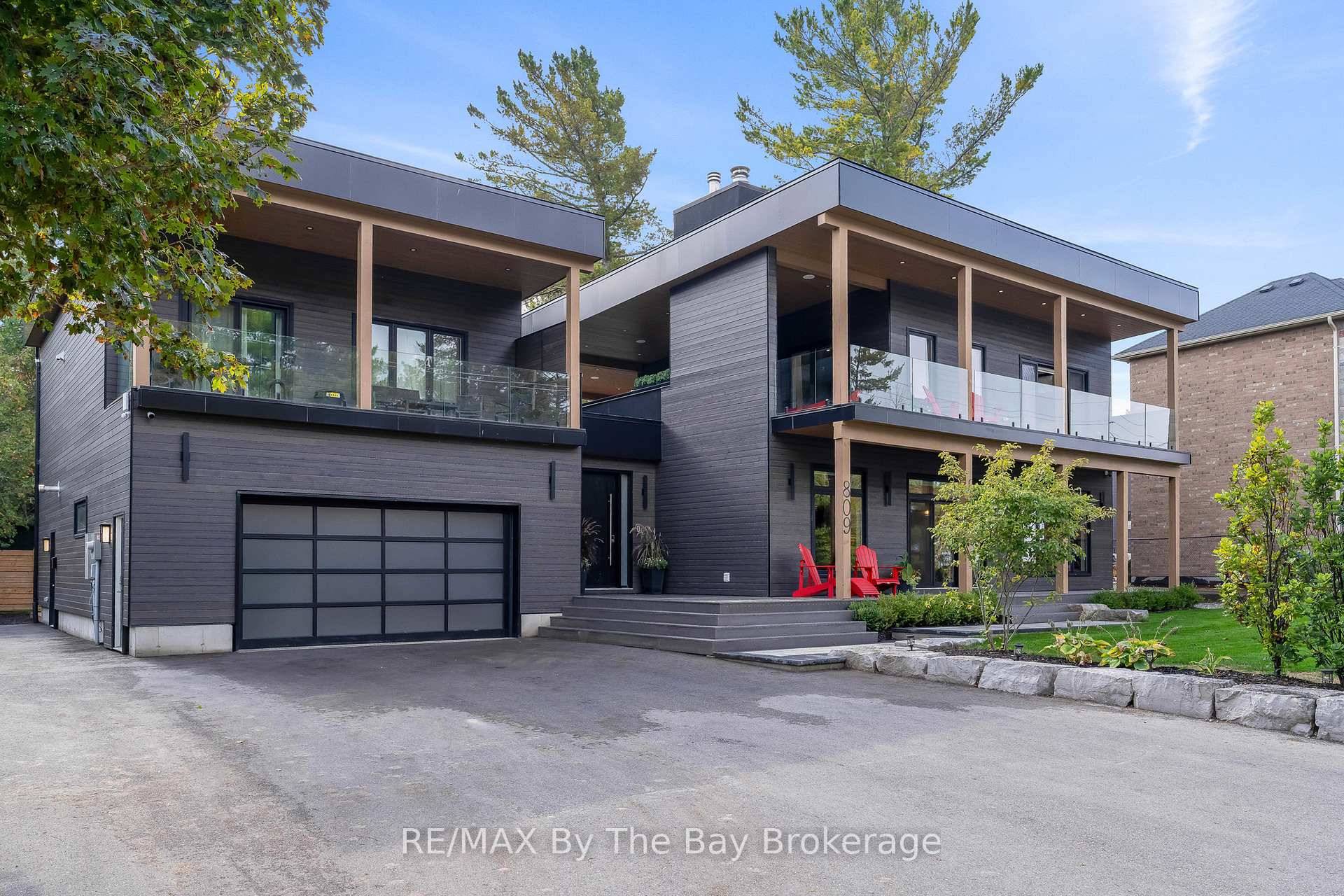 Experience refined coastal living in this extraordinary newer built custom multi family home with a legal apartment, steps from the pristine sandy shores of Allenwood Beach on beautiful Georgian Bay.