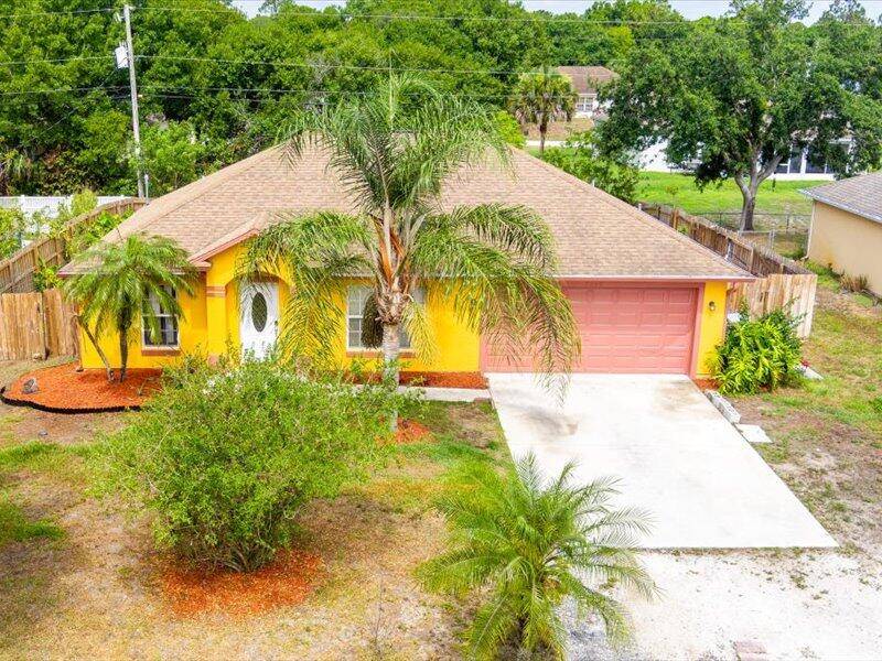 This home is situated in the quiet community of Vero Lake Estates.
