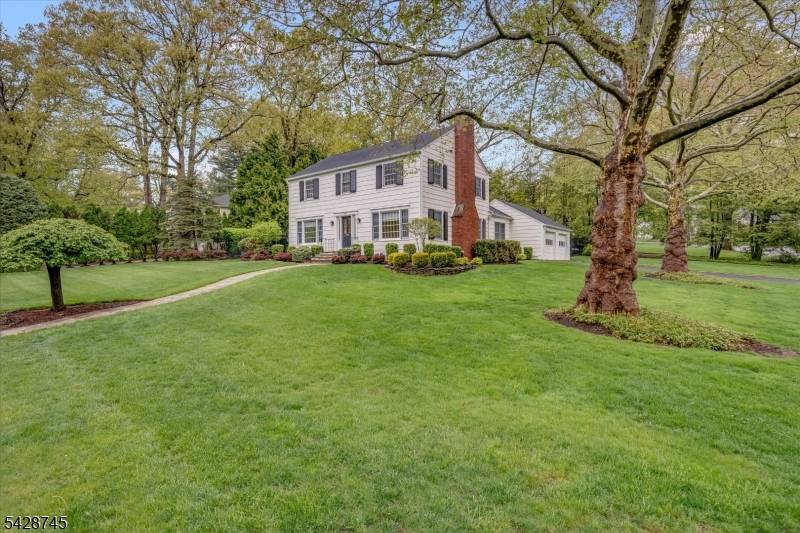 Gracefully set on a beautiful property in the Hartshorn section of Short Hills, this classic Center Hall Colonial blends timeless design with a warm, inviting feel.