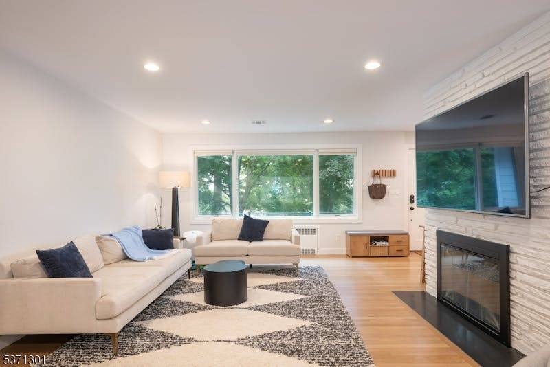 Discover this exquisite renovated ranch style home, where contemporary design and open spaces harmoniously blend.