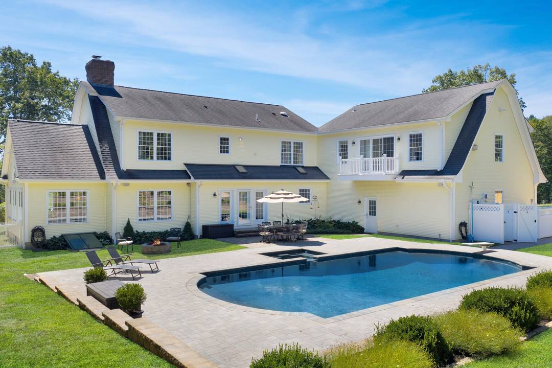 Exceptional 4 Bedroom Colonial with Pool, 4 Car Garage Capacity Fabulous Outdoor Living.