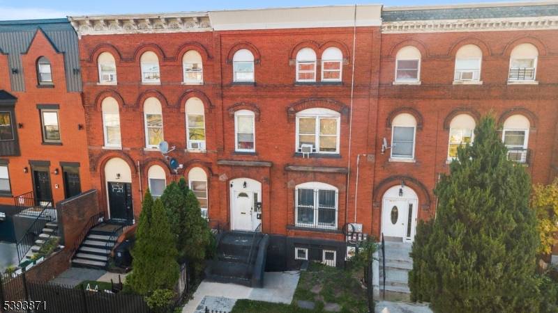 Back on the Market ! Welcome to this renovated Brick Beauty a timeless 2 family home blending classic 1887 architecture with modern comfort and space.
