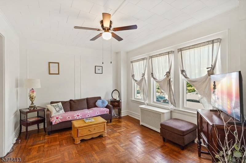 This charming two family home is tucked away on a peaceful, quintessentially tree lined street and offers incredible potential.