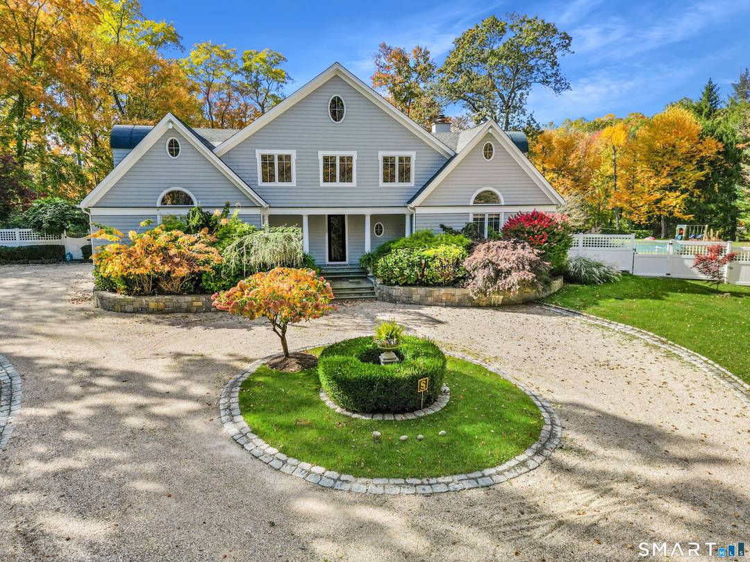 Welcome to this North Stamford retreat, gracefully set on 2.