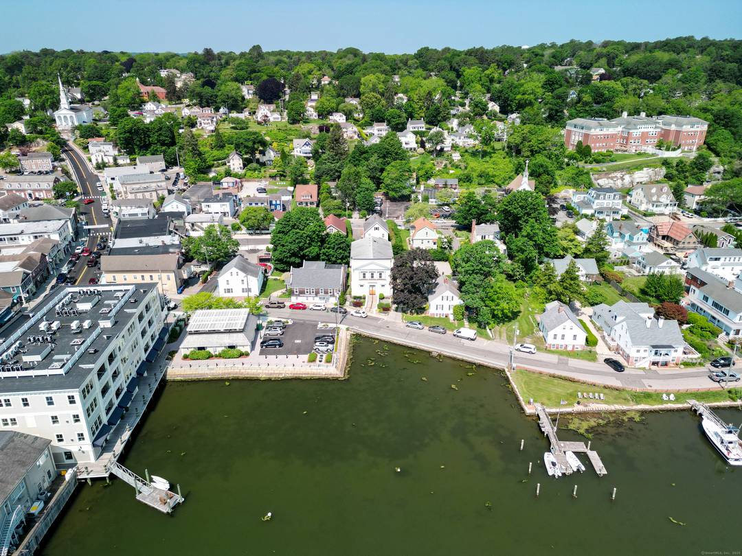Discover unparalleled one level living in this stunning 2, 338 square foot condominium in Historic Downtown Mystic, Connecticut across from the Mystic River and Bascule Bridge.