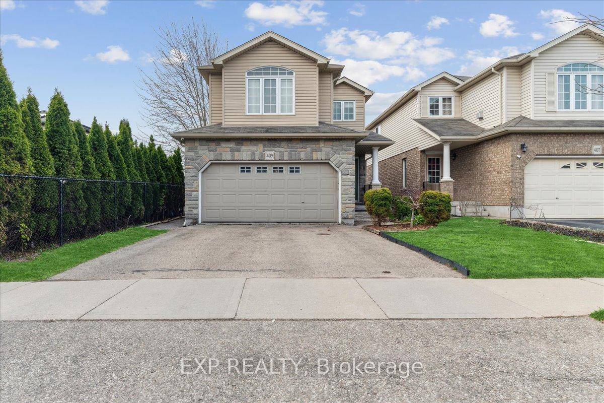 This beautifully maintained home features outstanding curb appeal with a stone front elevation, brick and vinyl siding.