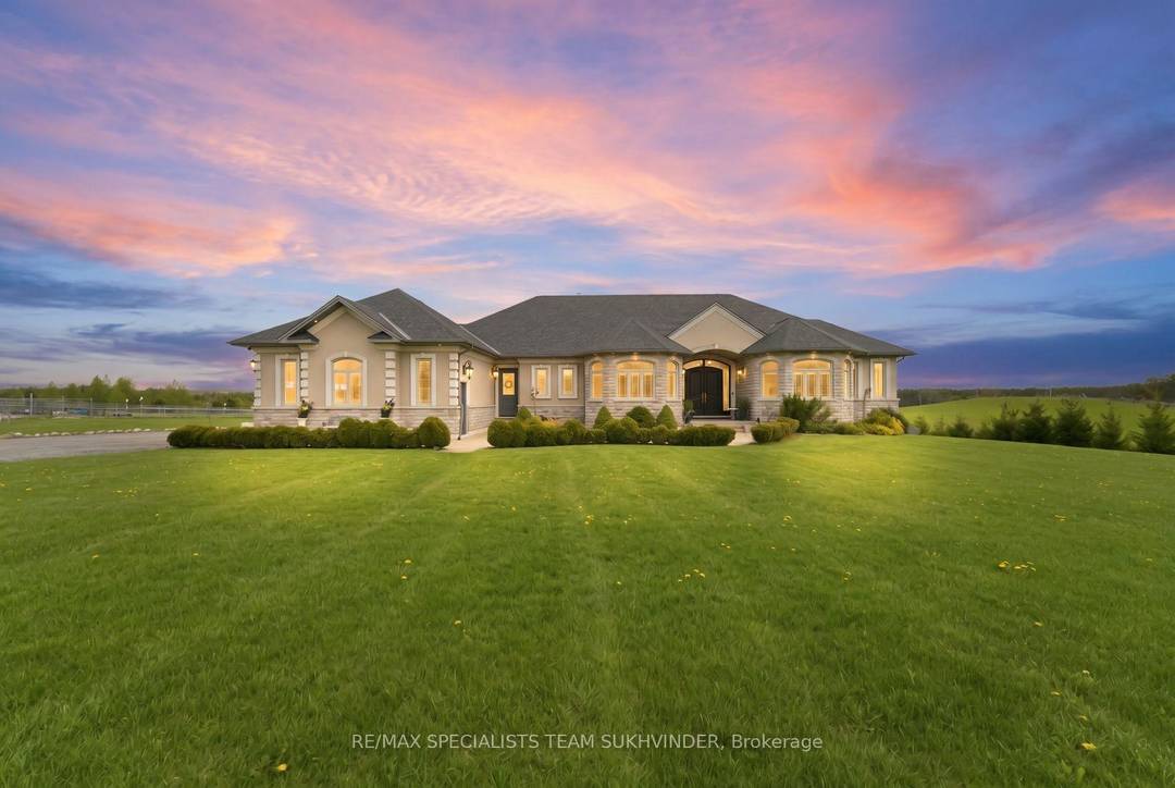 Welcome to this extraordinary custom built bungalow nestled on 25 clear acres, offering over 5, 500 sq.