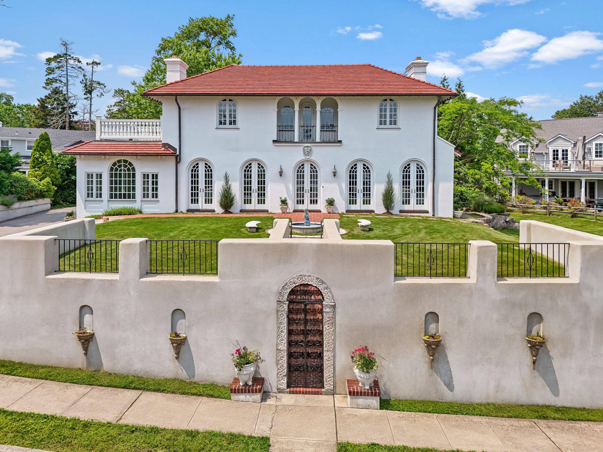 Rare find ! Mediterranean gem overlooking the Sound with piazza, fountains and a storied past.
