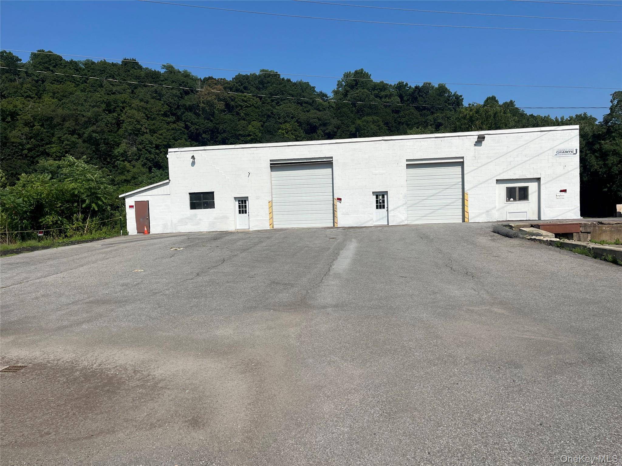 7, 100 sf Commercial Industrial zoned warehouse offers 2 oversized garage bays with 10' doors, 2 offices, 2 new baths.