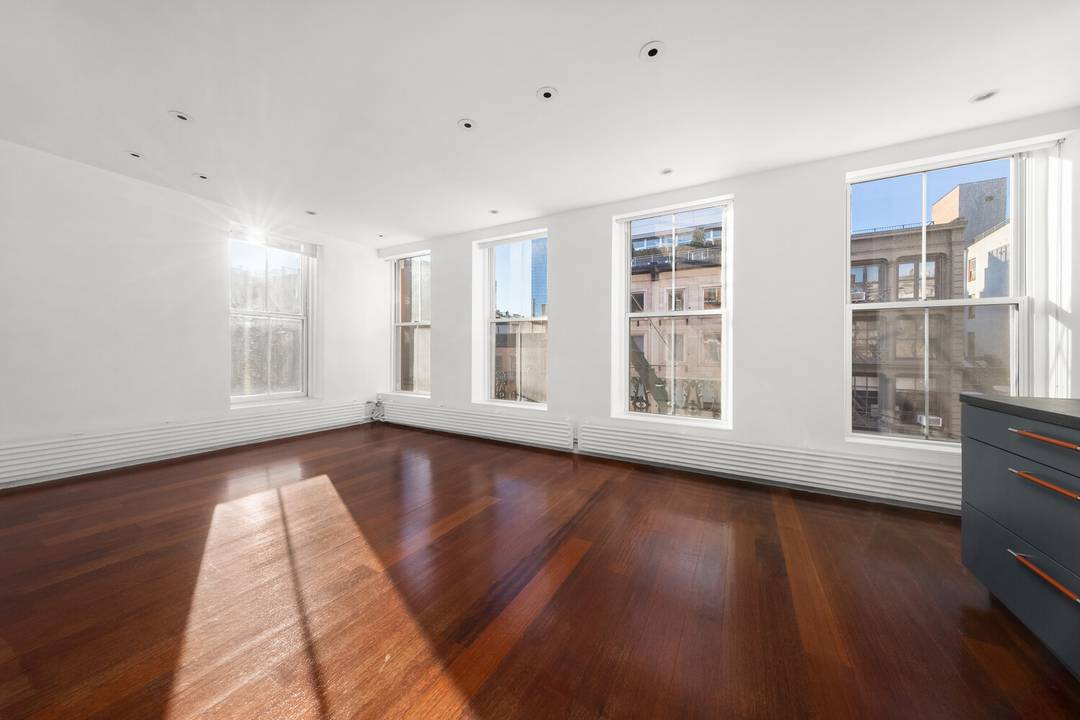 Newly listed ! The Eklund Gomes Team presents this rare opportunity to own a spacious historic loft flooded with natural light from three exposures.