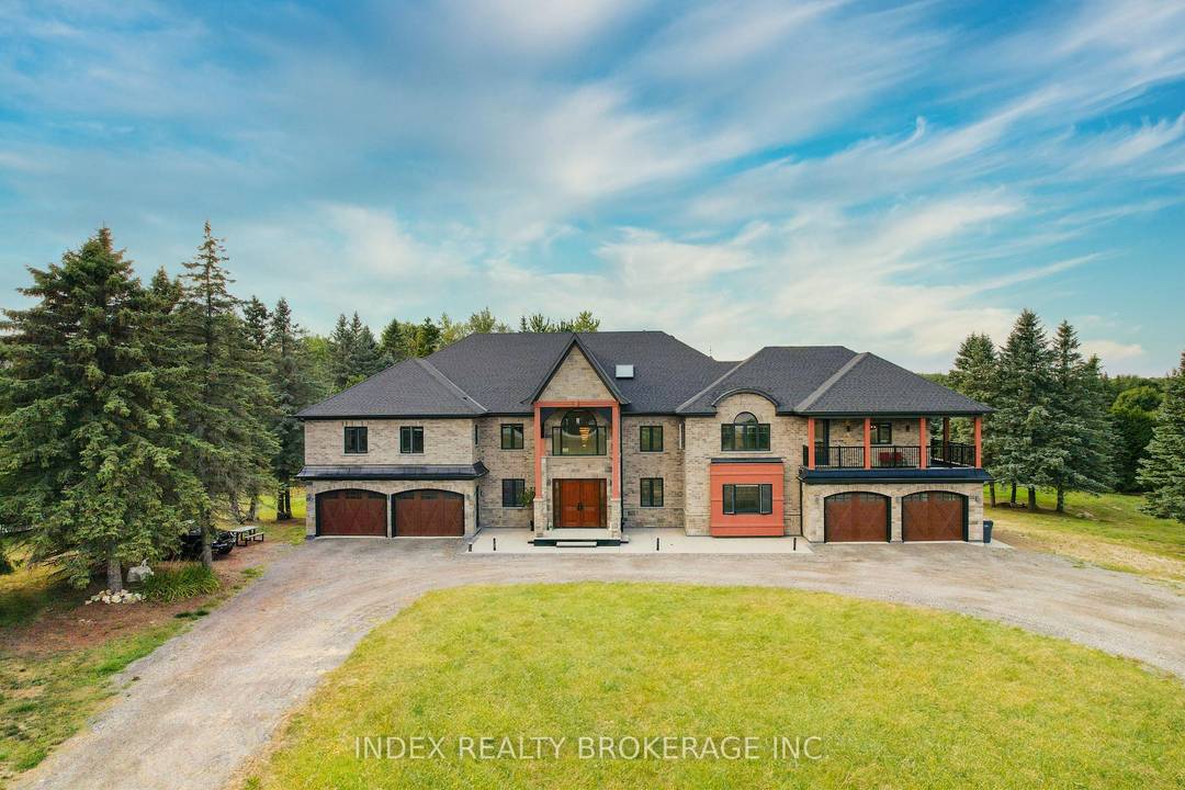 This breathtaking custom built luxury estate sits on a private 3.