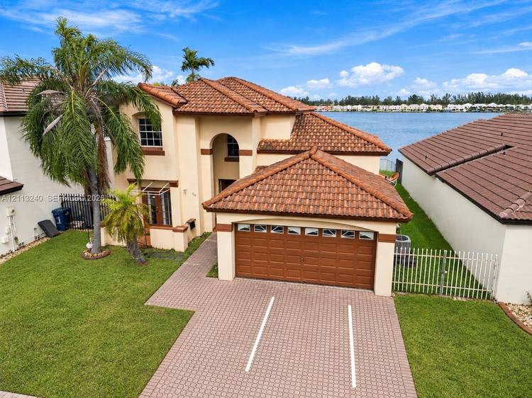 Lakefront views, high ceilings, and very low HOA fees plus a walk to the private clubhouse, swimming pool, tennis courts, and community park make this 4 bedroom, 3 bath single ...
