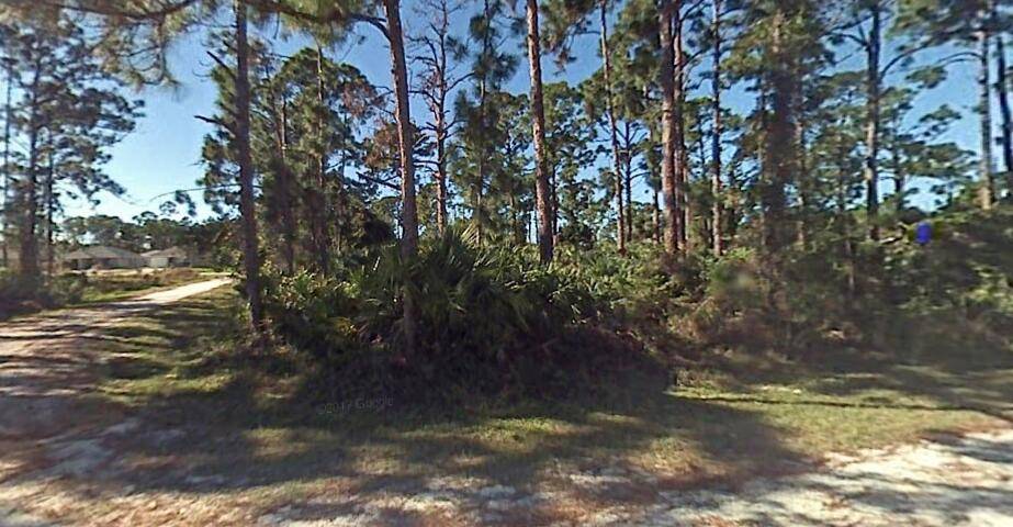 Great opportunity to build your dream home on a beautiful corner lot in quaint neighborhood of Vero Beach !