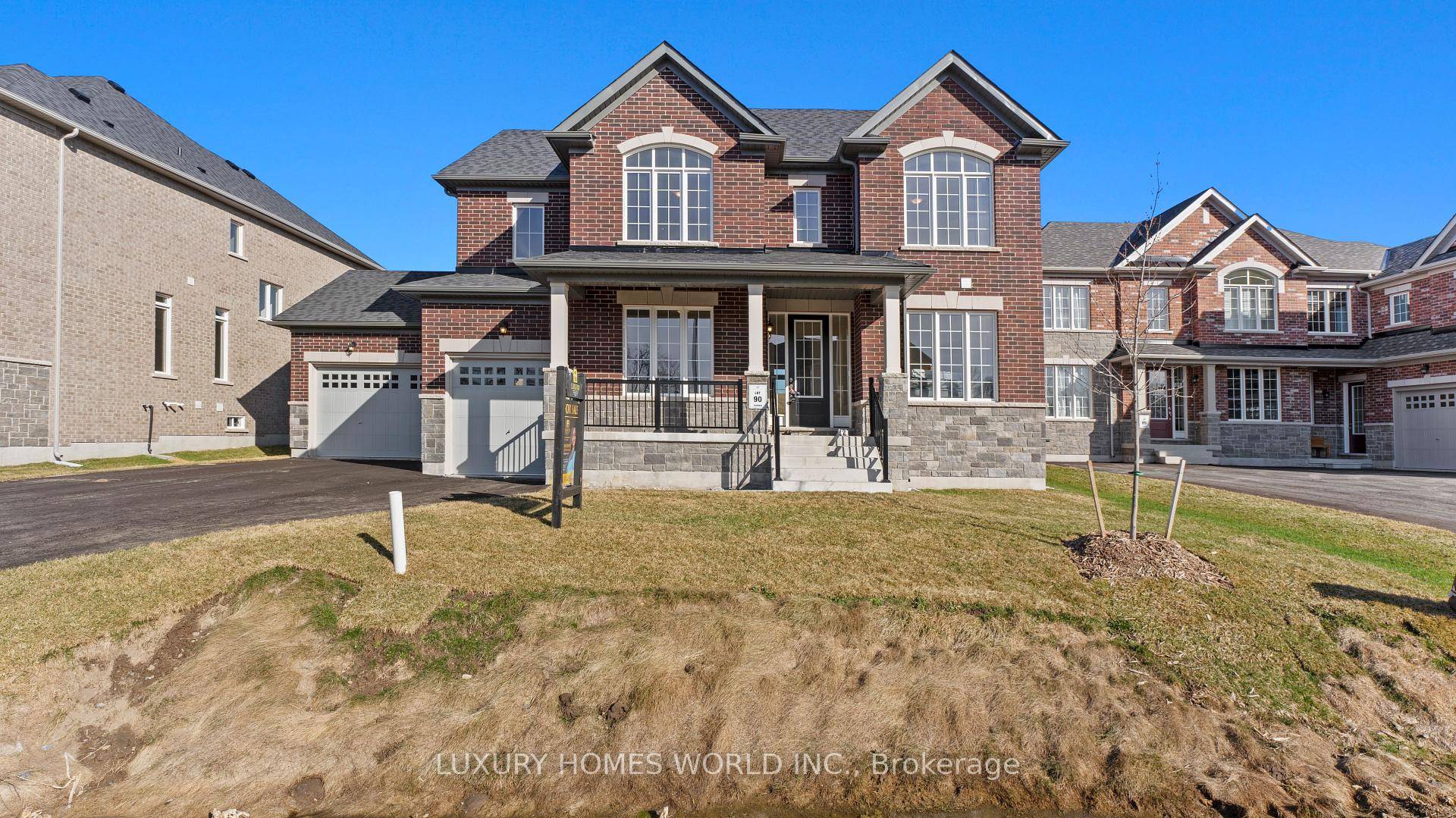 This property is a fully detached brick estate home in Riverbend Estates, featuring four bedrooms, four bathrooms, and a three car garage, which sits on a large lot.