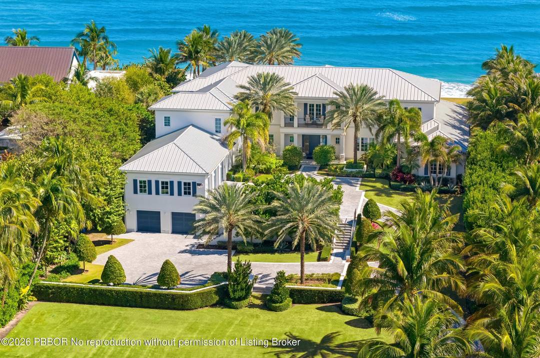 Stunning Ocean to Lake estate set on an oversized, premier Manalapan lot with 150 feet of direct ocean frontage.