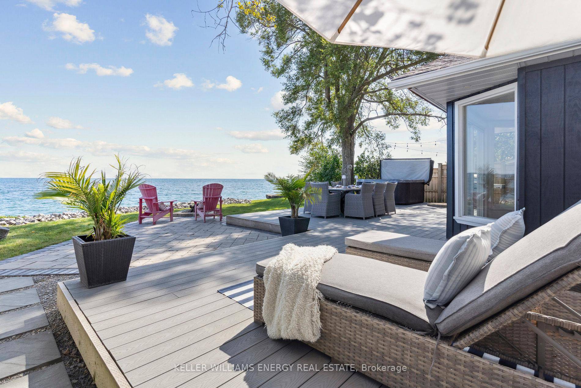 Awaken to sweeping views of Lake Ontario from this elegant waterfront bungalow, set on a rare 300 ft deep private lot.