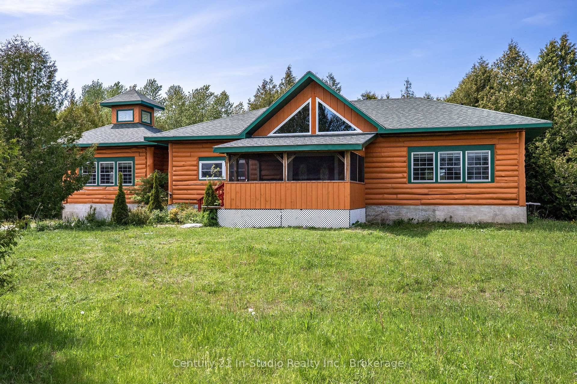 TURNKEY LOG HOME ON OVER AN ACRE IN TOBERMORY !