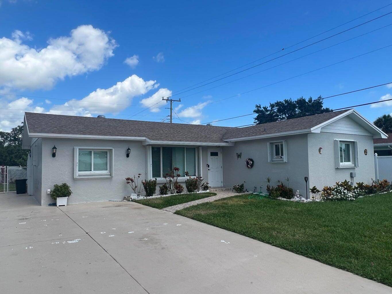 One story ranch style home with 4 bedrooms and 2 baths in the heart of Palm Beach Gardens with no HOA.