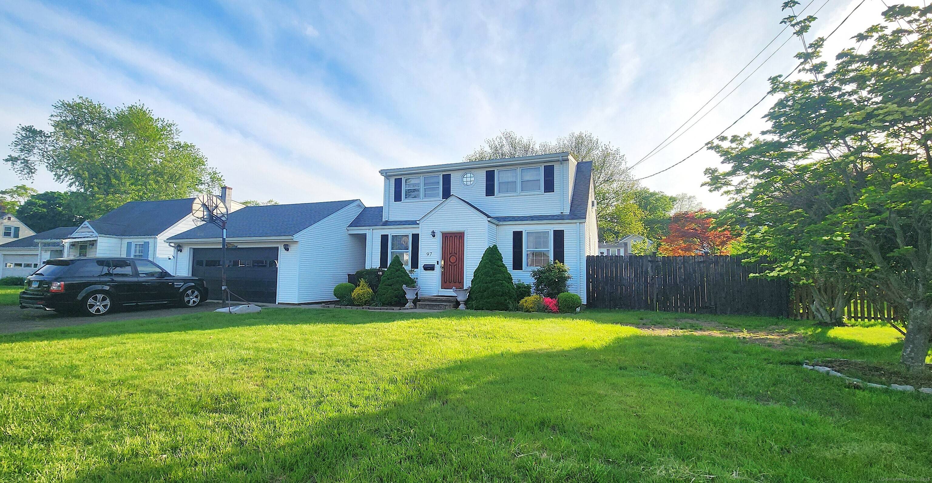 Lovely Cape Cod style home with many fantastic updates and a level backyard with a pool !