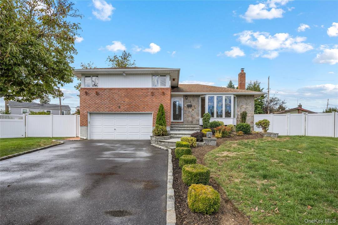 This beautifully renovated split level home is tucked away on a peaceful cul de sac in the sought after Plainview Old Bethpage School District.
