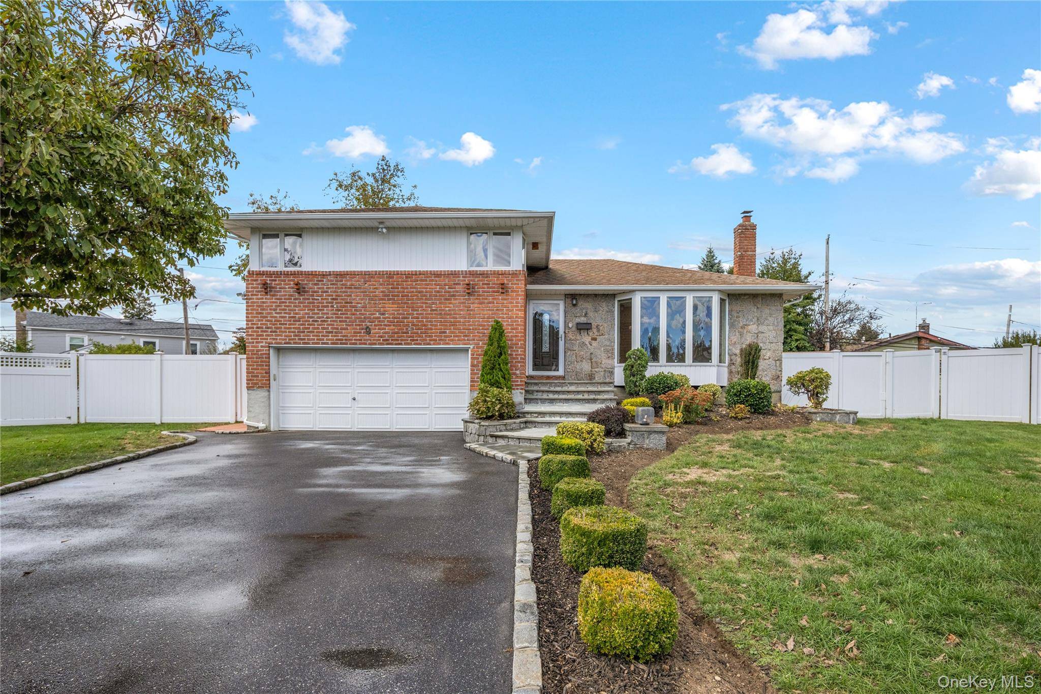 This beautifully renovated split level home is tucked away on a peaceful cul de sac in the sought after Plainview Old Bethpage School District.