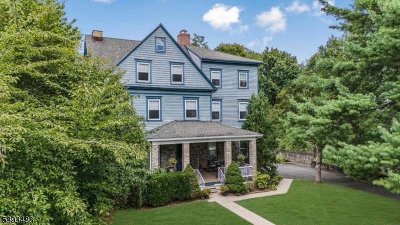 Welcome to 23 Euclid Avenue, a sun filled and well maintained four unit multifamily home located in the heart of Summit.