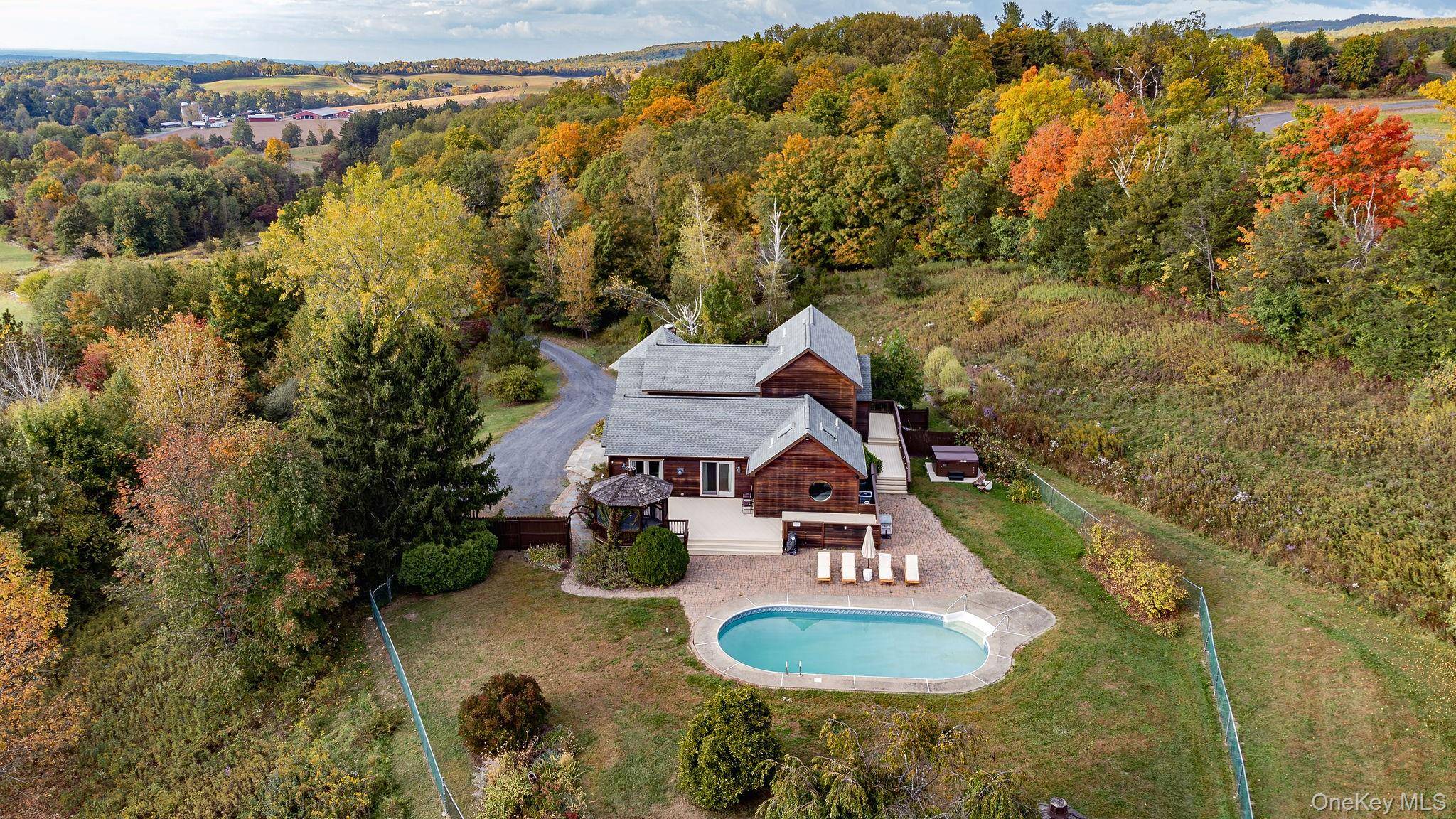 Set on 11. 71 private acres just 10 minutes from downtown Hudson, 126 Taghkanic Churchtown Road offers privacy and tranquility in a serene hilltop setting.