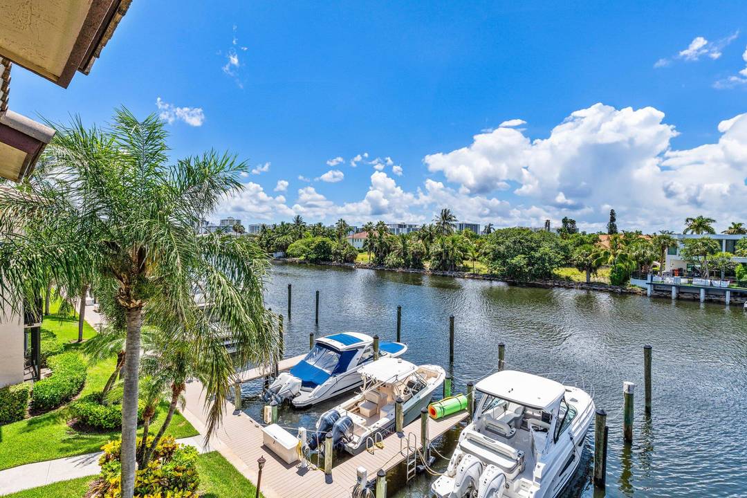 DIRECT WATERFRONT CAPTAINS WALK 2 STORY TOWNHOUSE CONDO IN 24 HOUR GUARD GATED BOATING COMMUNITY PELICAN HARBOR.