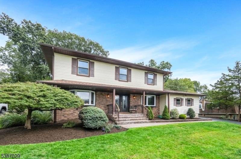 Welcome to this entertainer's dream in Parsippany's sought after Intervale community !