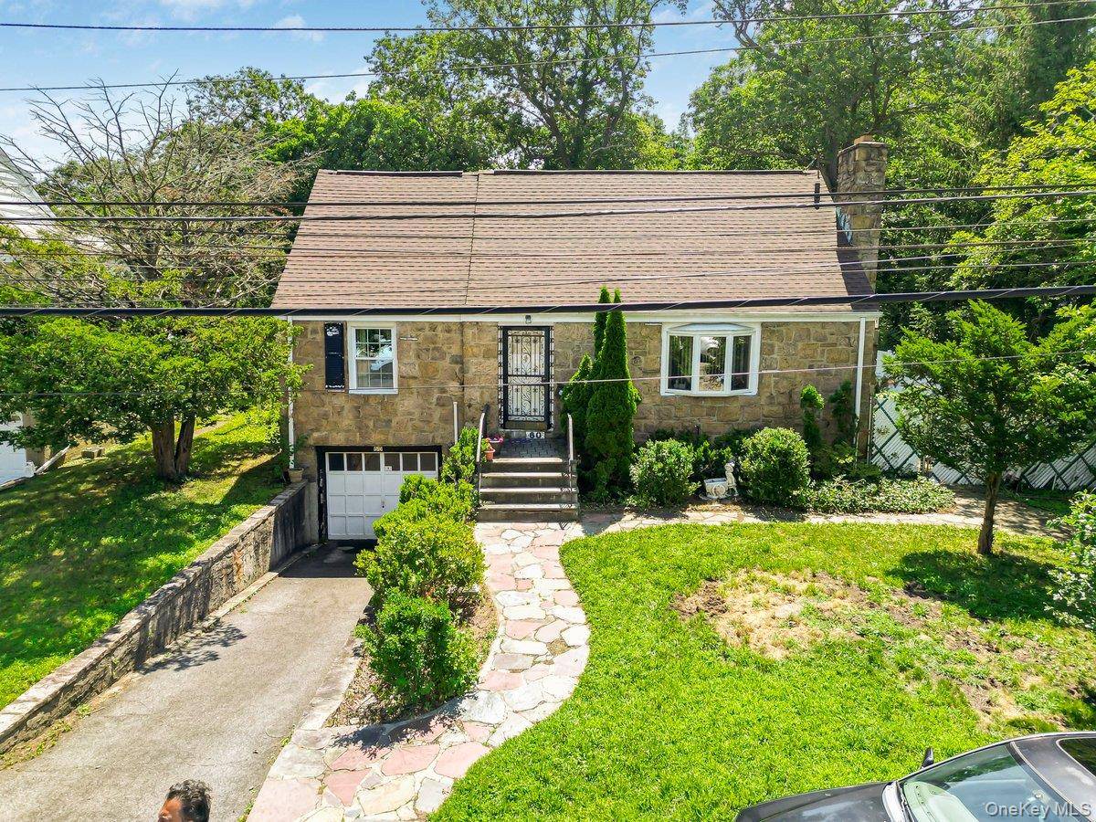 Welcome to 60 Gramercy Avenue, a wonderful 4 bedroom 2 bathroom Cape Cod style home nestled away on a sprawling 0.