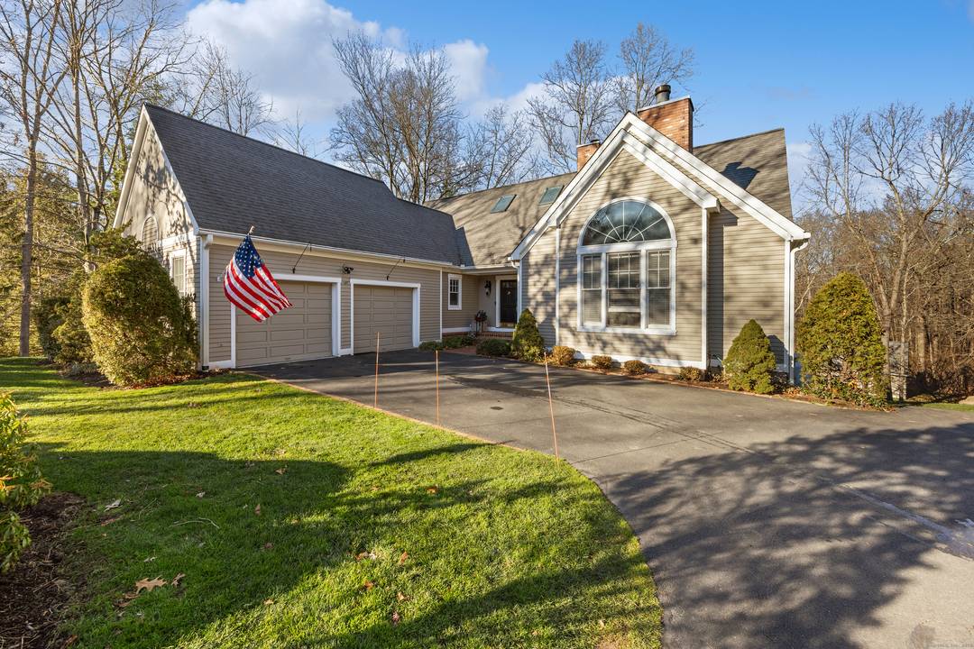 Welcome home to this beautifully maintained cape style condo tucked within a quiet Cheshire community near the town center.
