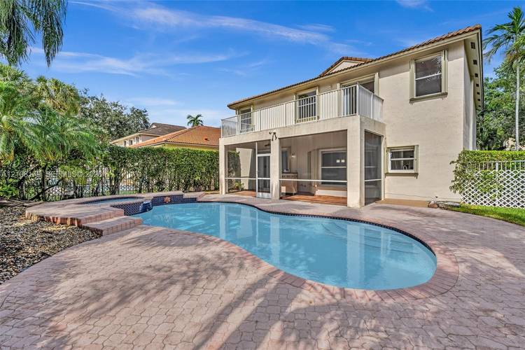 Beautiful 5 bedroom, 3 bathroom pool home offering 2, 845 square feet of living space in the desirable gated community of Grand Palms in Pembroke Pines.