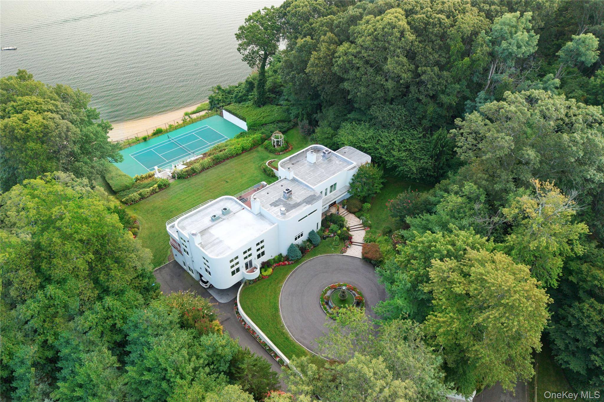 Experience the ultimate in waterfront living with this extraordinary 9, 000 sq.
